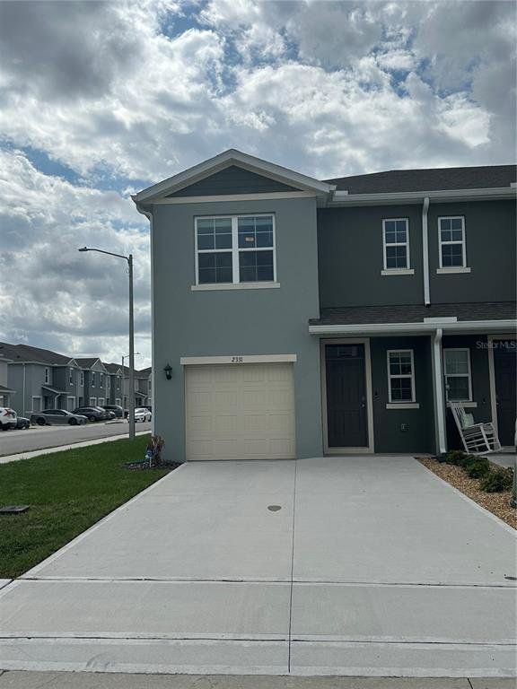 Front exterior of a new home in , Davenport, FL, highlighting curb appeal (Image 1). Front exterior of a new home in , Davenport, FL, highlighting curb appeal (Image 1).