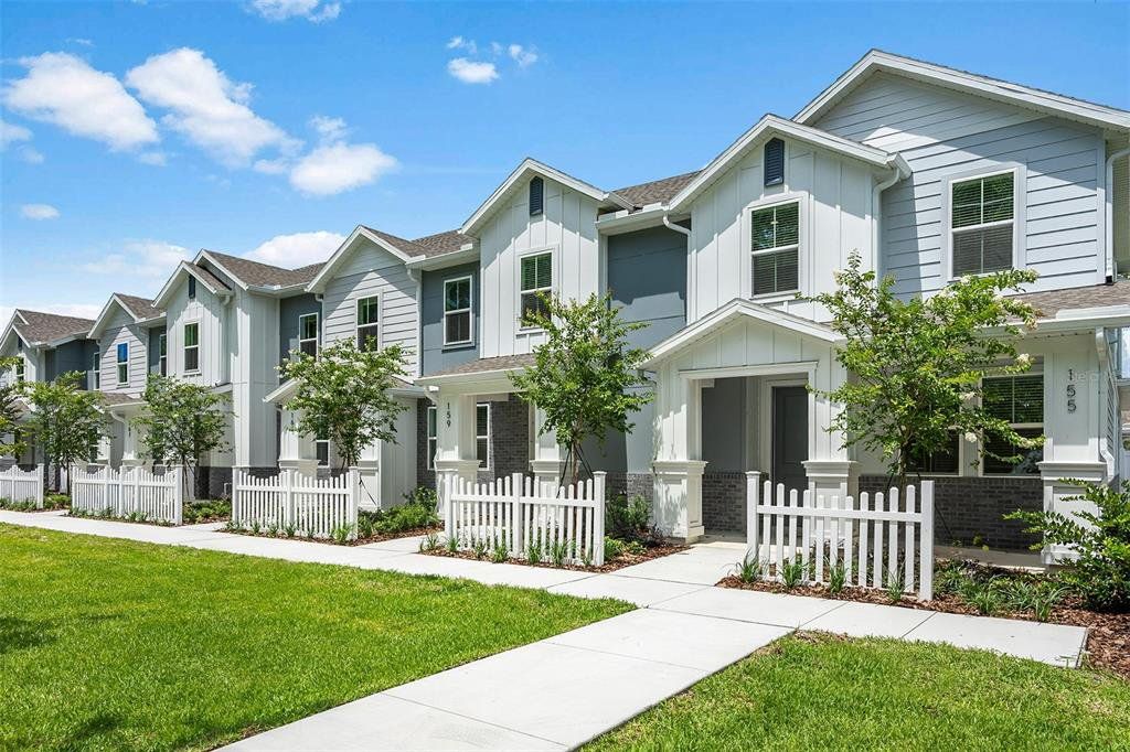 Front exterior of a new home in Aulin Square, Oviedo, FL, highlighting curb appeal (Image 1). Front exterior of a new home in Aulin Square, Oviedo, FL, highlighting curb appeal (Image 1).