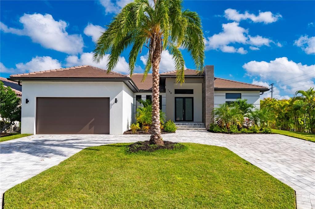 Front exterior of a new home in , Punta Gorda, FL, highlighting curb appeal (Image 1). Front exterior of a new home in , Punta Gorda, FL, highlighting curb appeal (Image 1).