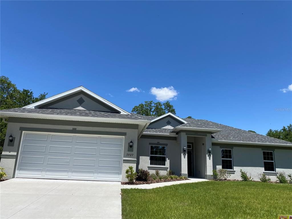 Front exterior of a new home in , North Port, FL, highlighting curb appeal (Image 1). Front exterior of a new home in , North Port, FL, highlighting curb appeal (Image 1).