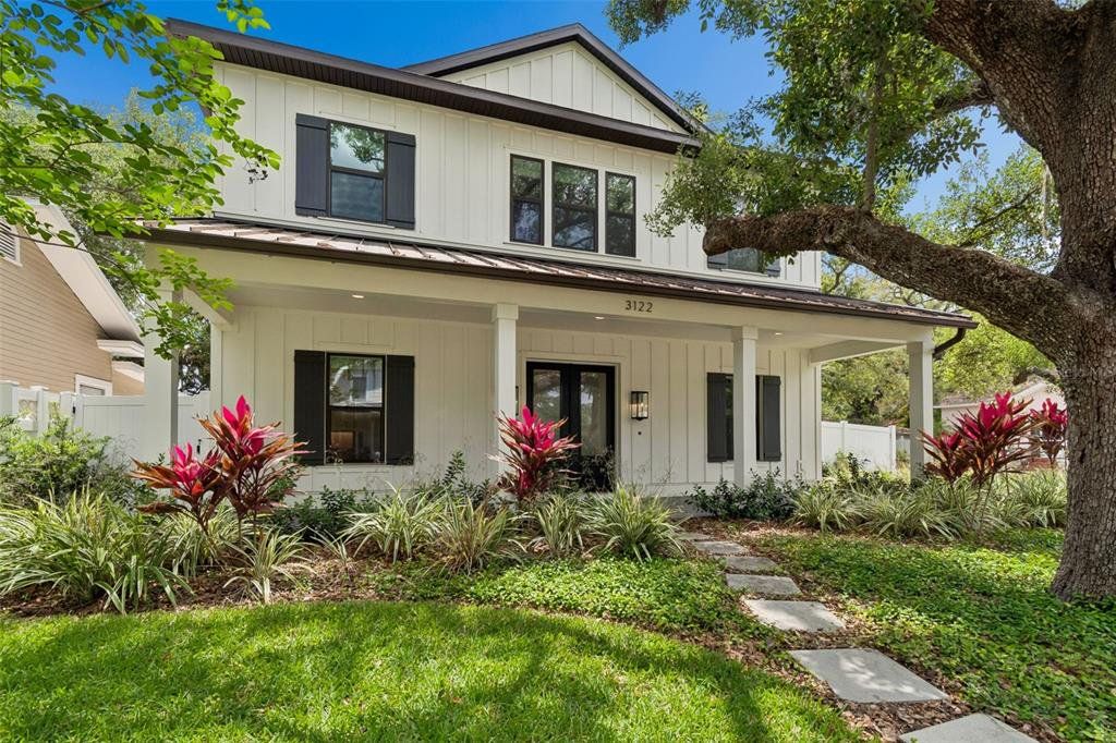 Front exterior of a new home in , Tampa, FL, highlighting curb appeal (Image 1). Front exterior of a new home in , Tampa, FL, highlighting curb appeal (Image 1).