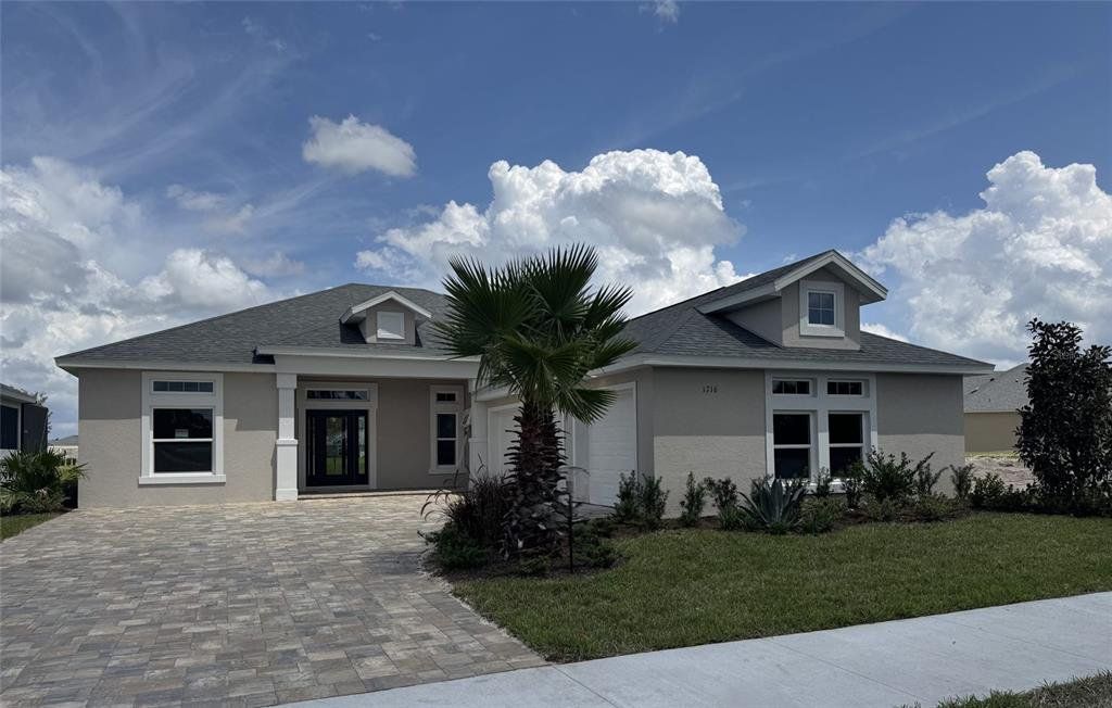 Front exterior of a new home in The Reserve at Victoria, Deland, FL, highlighting curb appeal (Image 1). Front exterior of a new home in The Reserve at Victoria, Deland, FL, highlighting curb appeal (Image 1).