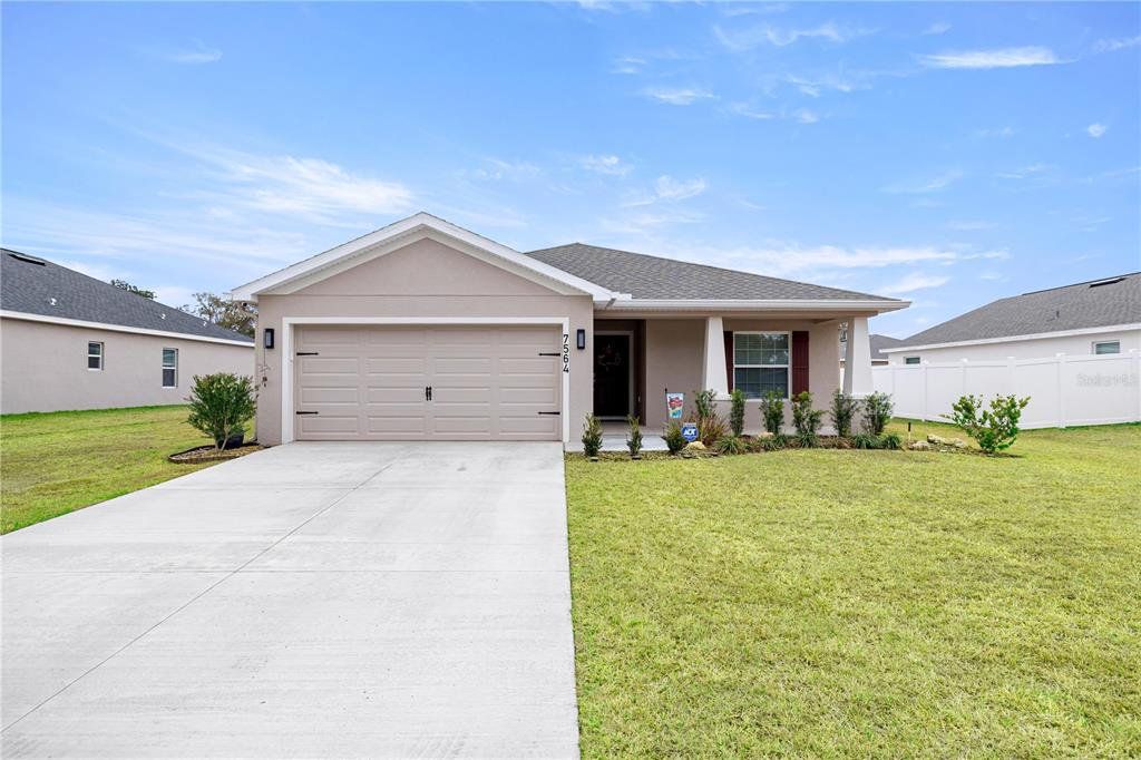 Front exterior of a new home in , Ocala, FL, highlighting curb appeal (Image 1). Front exterior of a new home in , Ocala, FL, highlighting curb appeal (Image 1).