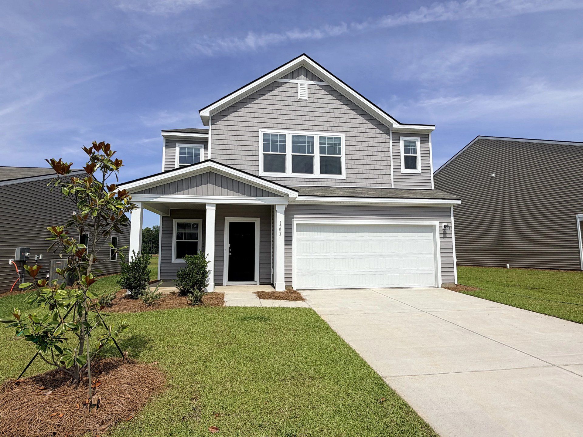 Front exterior of a new home in Watson Hill, Summerville, SC, highlighting curb appeal (Image 1). Front exterior of a new home in Watson Hill, Summerville, SC, highlighting curb appeal (Image 1).