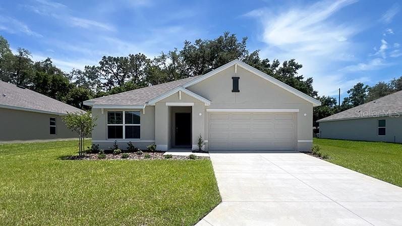 Front exterior of a new home in Sunset Hills, Summerfield, FL, highlighting curb appeal (Image 1). Front exterior of a new home in Sunset Hills, Summerfield, FL, highlighting curb appeal (Image 1).