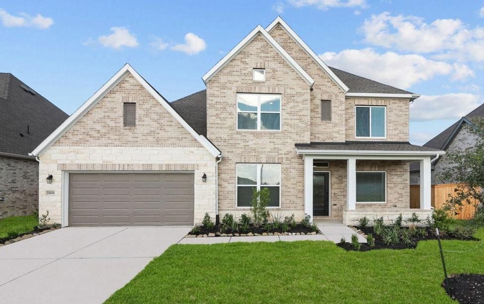 Representative exterior photo of a completed home built from the The Sagebrook by David Weekley Homes in Oakwood Estates, Waller, TX (Image 1). Representative exterior photo of a completed home built from the The Sagebrook by David Weekley Homes in Oakwood Estates, Waller, TX (Image 1).