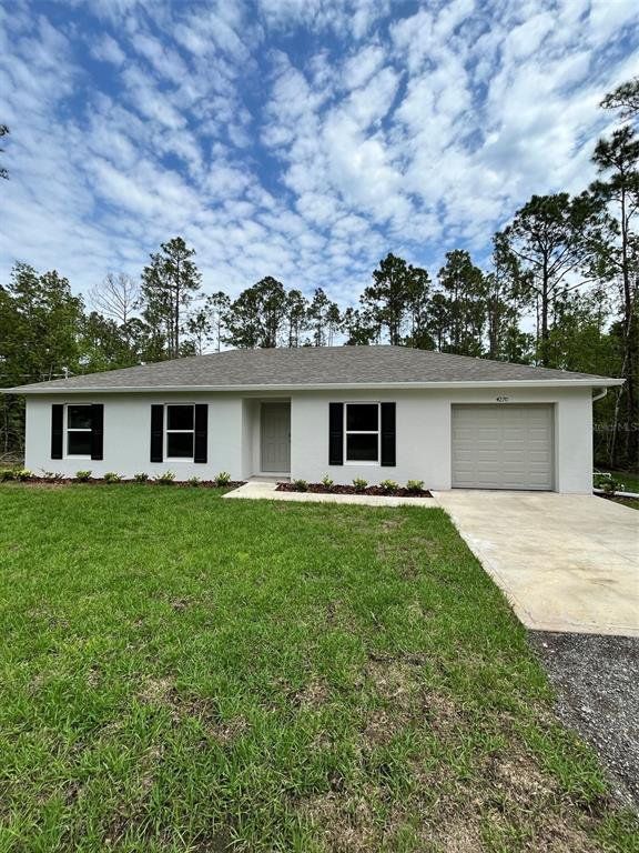 Front exterior of a new home in Flagler Estates, Hastings, FL, highlighting curb appeal (Image 1). Front exterior of a new home in Flagler Estates, Hastings, FL, highlighting curb appeal (Image 1).