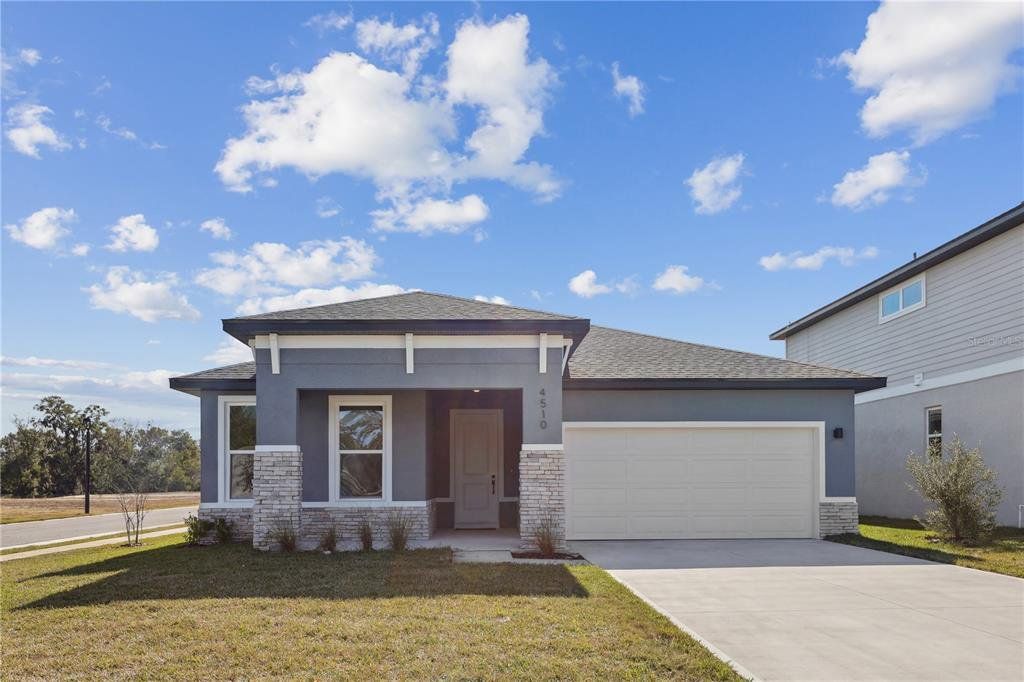 Front exterior of a new home in Sabana Reserve, Ocala, FL, highlighting curb appeal (Image 1). Front exterior of a new home in Sabana Reserve, Ocala, FL, highlighting curb appeal (Image 1).