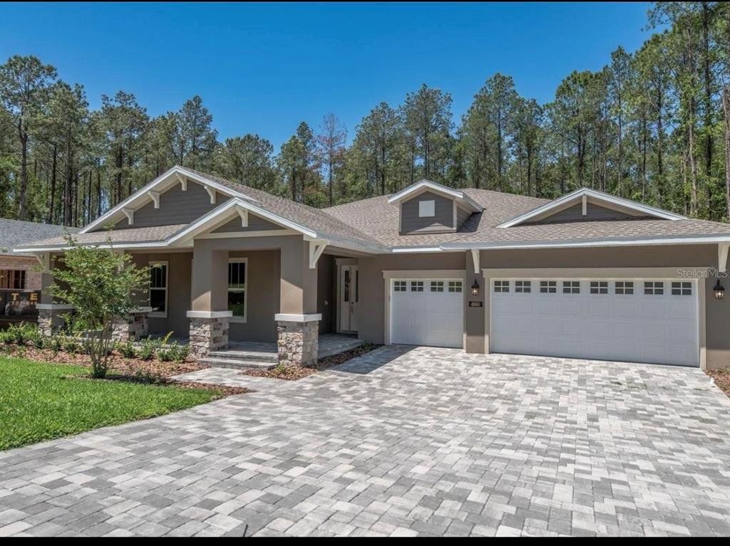 Front exterior of a new home in Southern Hills Plantation, Brooksville, FL, highlighting curb appeal (Image 1).