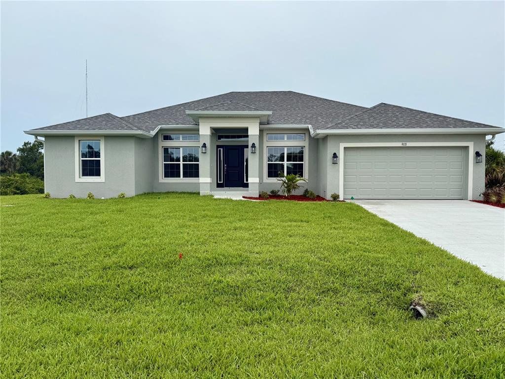Front exterior of a new home in South Gulf Cove, Port Charlotte, FL, highlighting curb appeal (Image 1). Front exterior of a new home in South Gulf Cove, Port Charlotte, FL, highlighting curb appeal (Image 1).