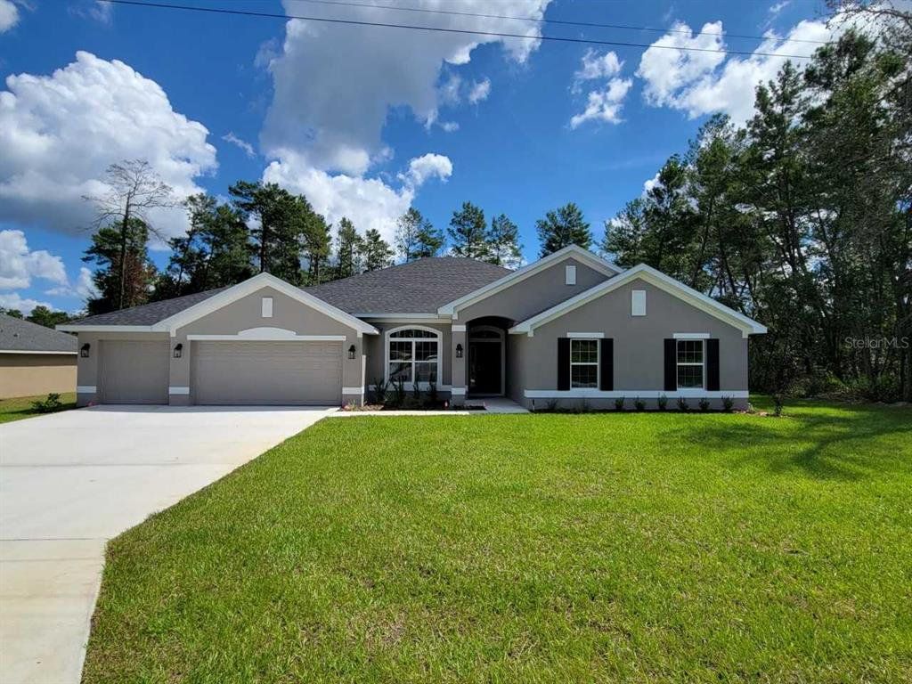 Front exterior of a new home in Marion Oaks, Ocala, FL, highlighting curb appeal (Image 1). Front exterior of a new home in Marion Oaks, Ocala, FL, highlighting curb appeal (Image 1).