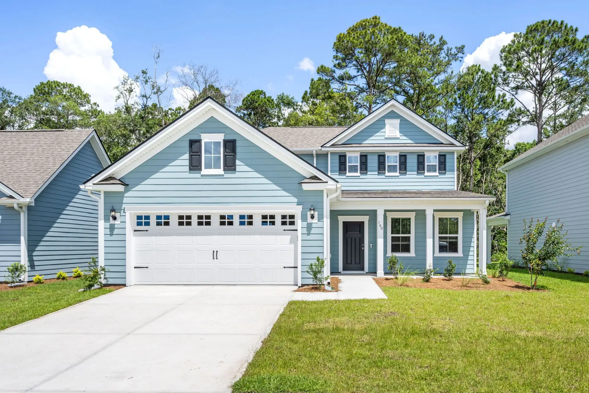 Front exterior of a new home in Solserra, Shallotte, NC, highlighting curb appeal (Image 1). Front exterior of a new home in Solserra, Shallotte, NC, highlighting curb appeal (Image 1).