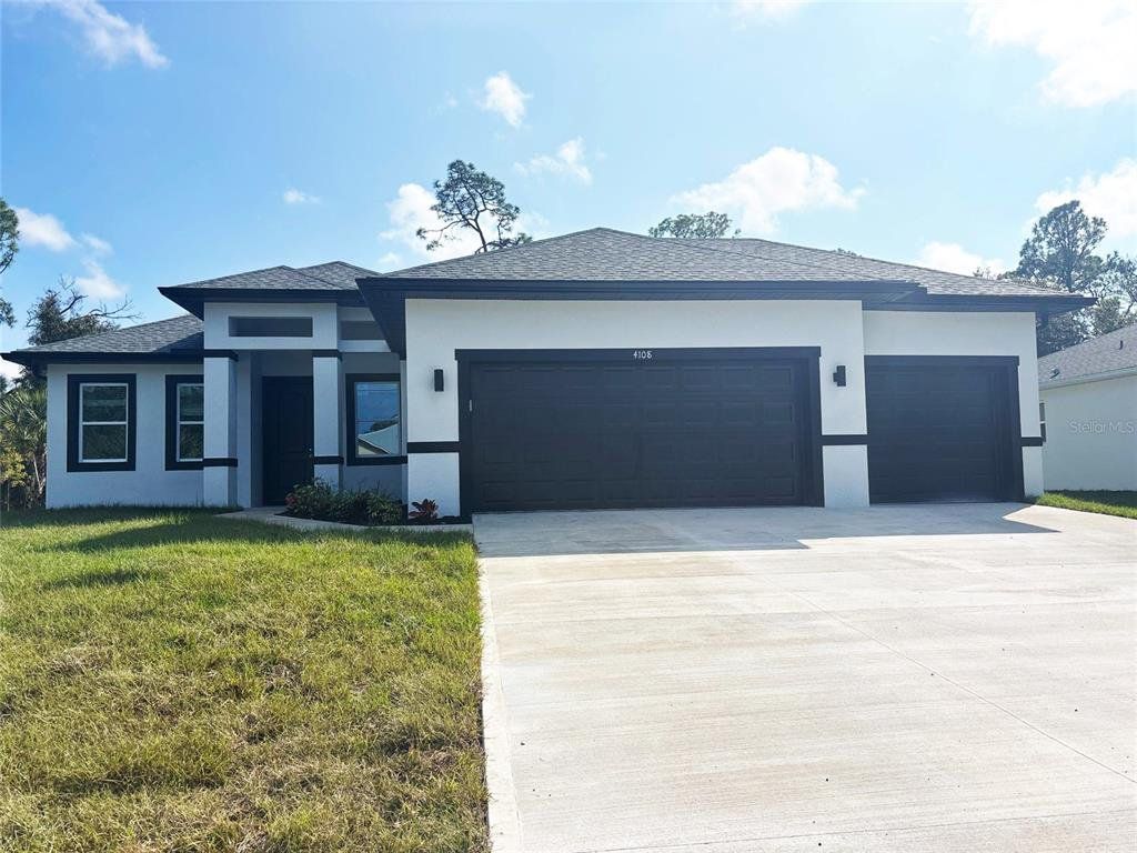 Front exterior of a new home in , North Port, FL, highlighting curb appeal (Image 1). Front exterior of a new home in , North Port, FL, highlighting curb appeal (Image 1).