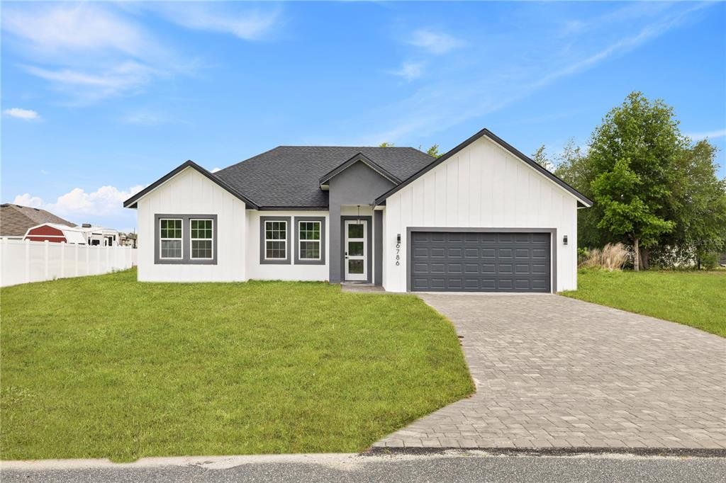 Front exterior of a new home in , Ocala, FL, highlighting curb appeal (Image 1). Front exterior of a new home in , Ocala, FL, highlighting curb appeal (Image 1).