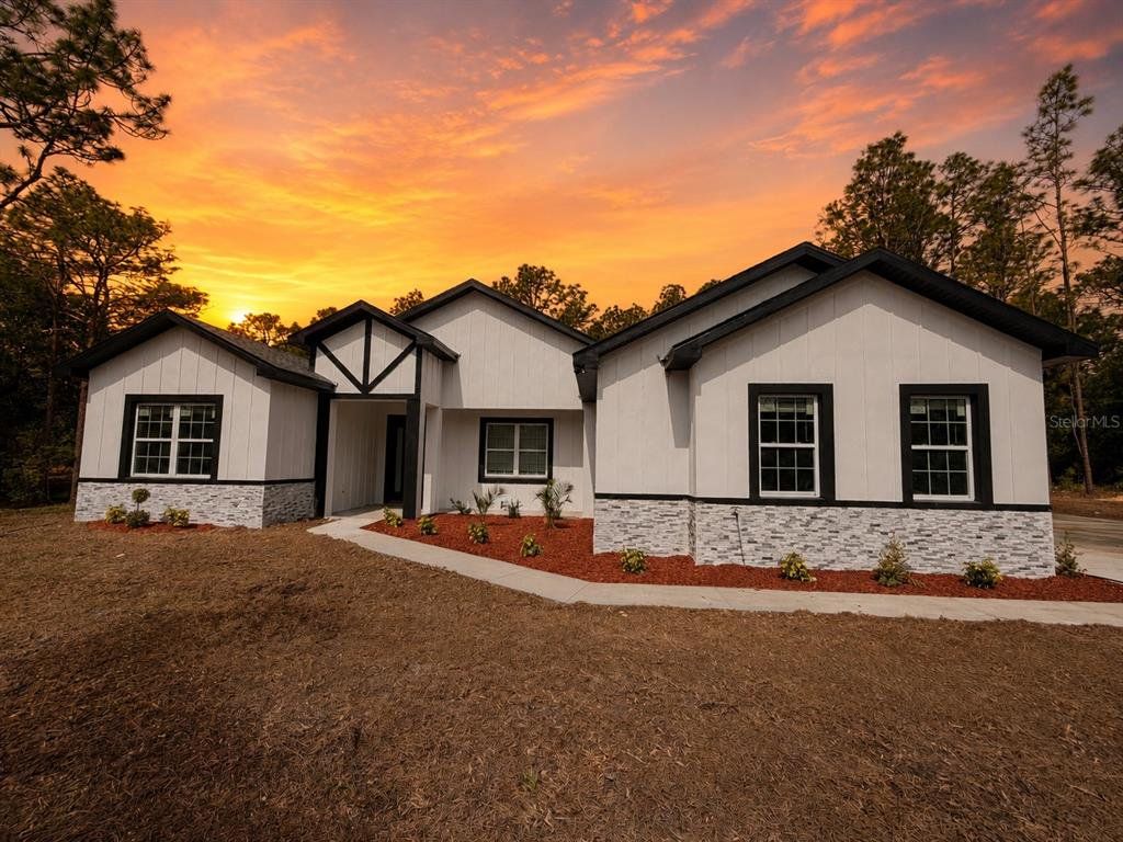 Front exterior of a new home in , Ocala, FL, highlighting curb appeal (Image 1). Front exterior of a new home in , Ocala, FL, highlighting curb appeal (Image 1).