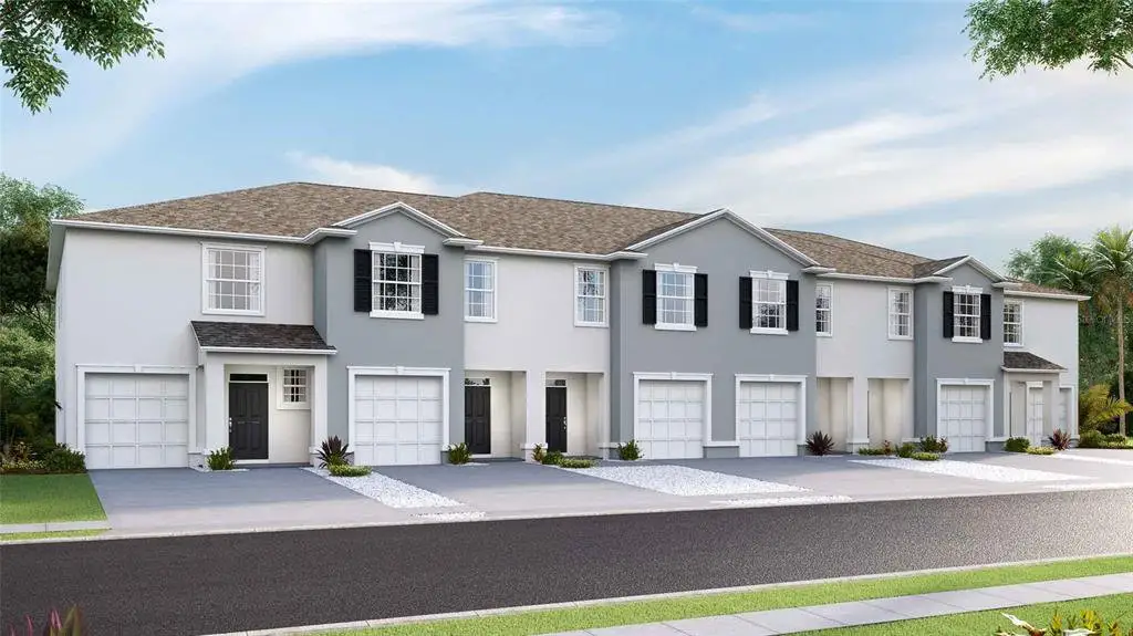 Front exterior of a new home in Meadow Ridge at Epperson, Wesley Chapel, FL, highlighting curb appeal (Image 1).