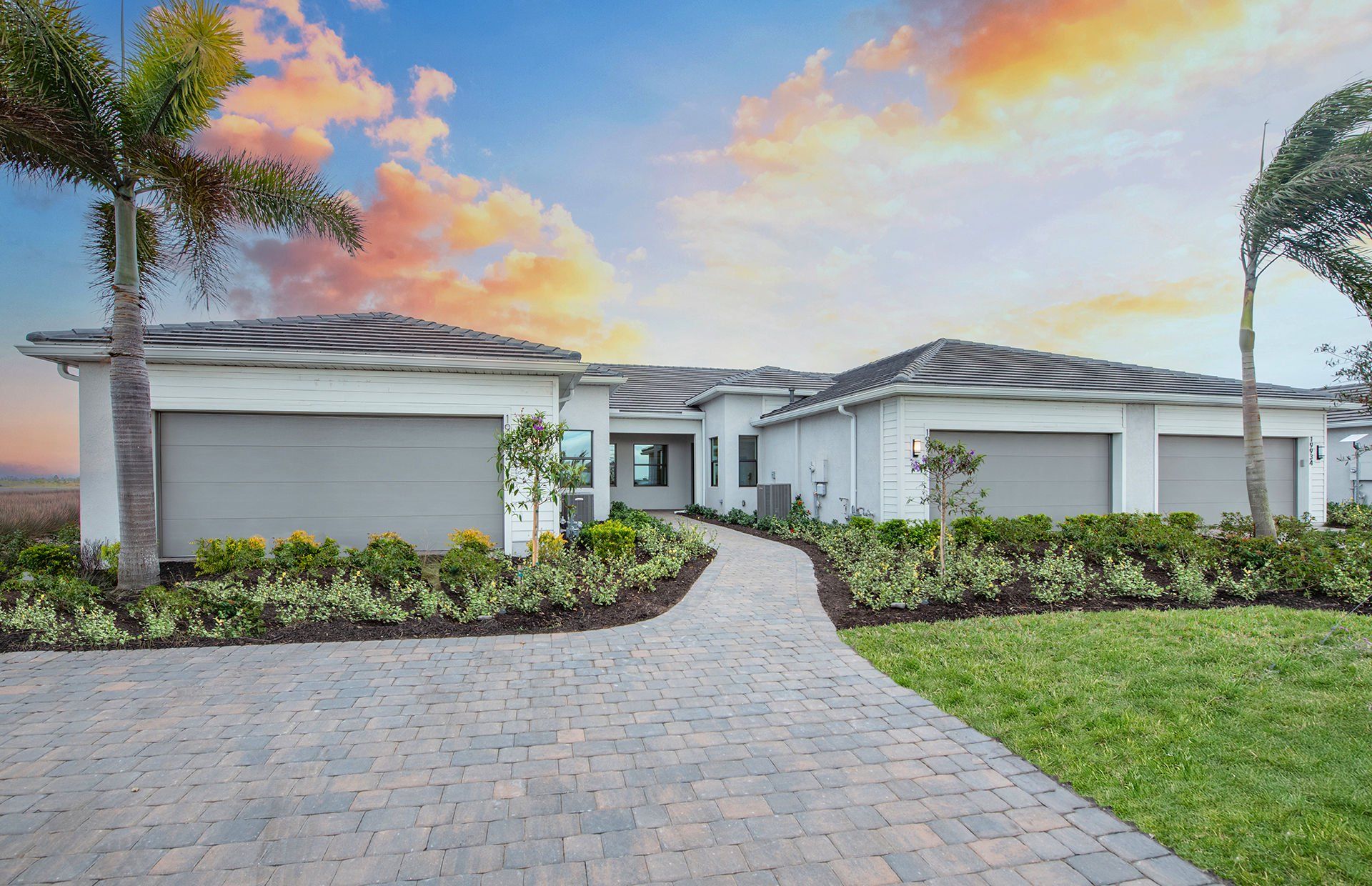 Front exterior of a new home in Del Webb Catalina, Lakewood Ranch, FL, highlighting curb appeal (Image 1).