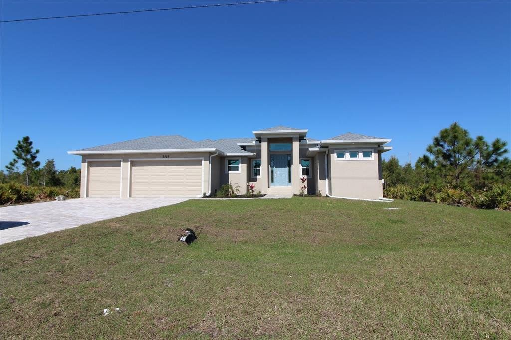 Front exterior of a new home in , Port Charlotte, FL, highlighting curb appeal (Image 1). Front exterior of a new home in , Port Charlotte, FL, highlighting curb appeal (Image 1).