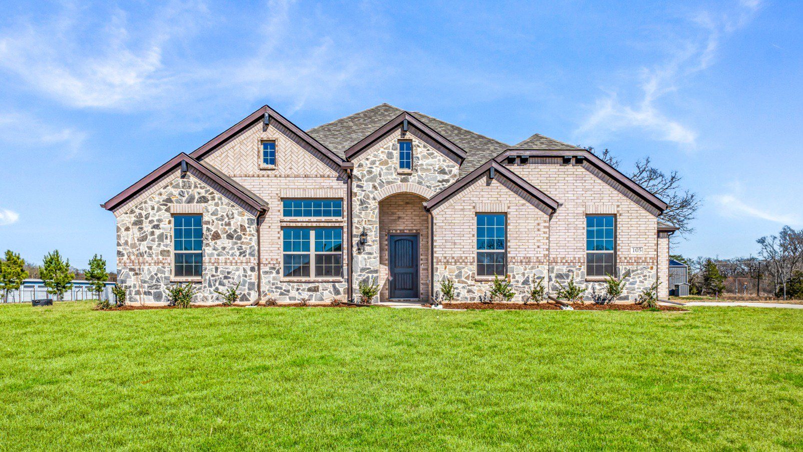 Front exterior of a new home in Lakeview Estates, Canton, TX, highlighting curb appeal (Image 1). Front exterior of a new home in Lakeview Estates, Canton, TX, highlighting curb appeal (Image 1).
