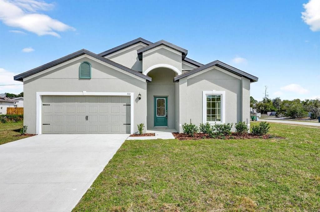 Front exterior of a new home in , Deltona, FL, highlighting curb appeal (Image 1). Front exterior of a new home in , Deltona, FL, highlighting curb appeal (Image 1).