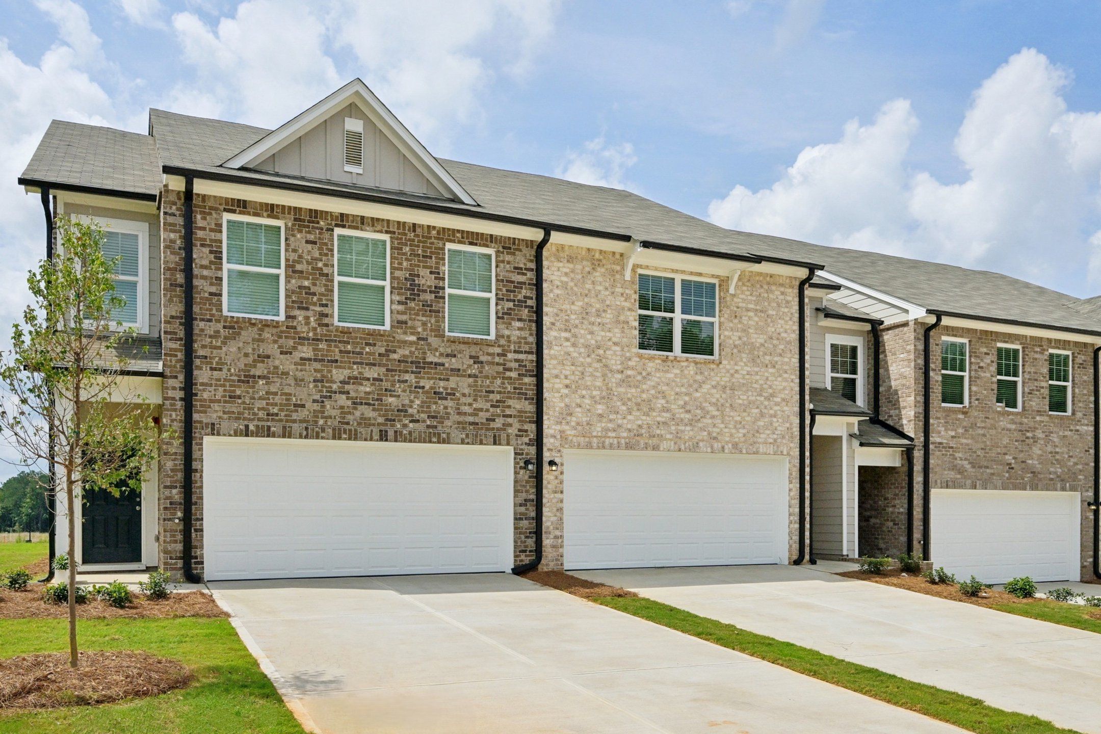 Front exterior of a new home in Kendall Grove, McDonough, GA, highlighting curb appeal (Image 1).