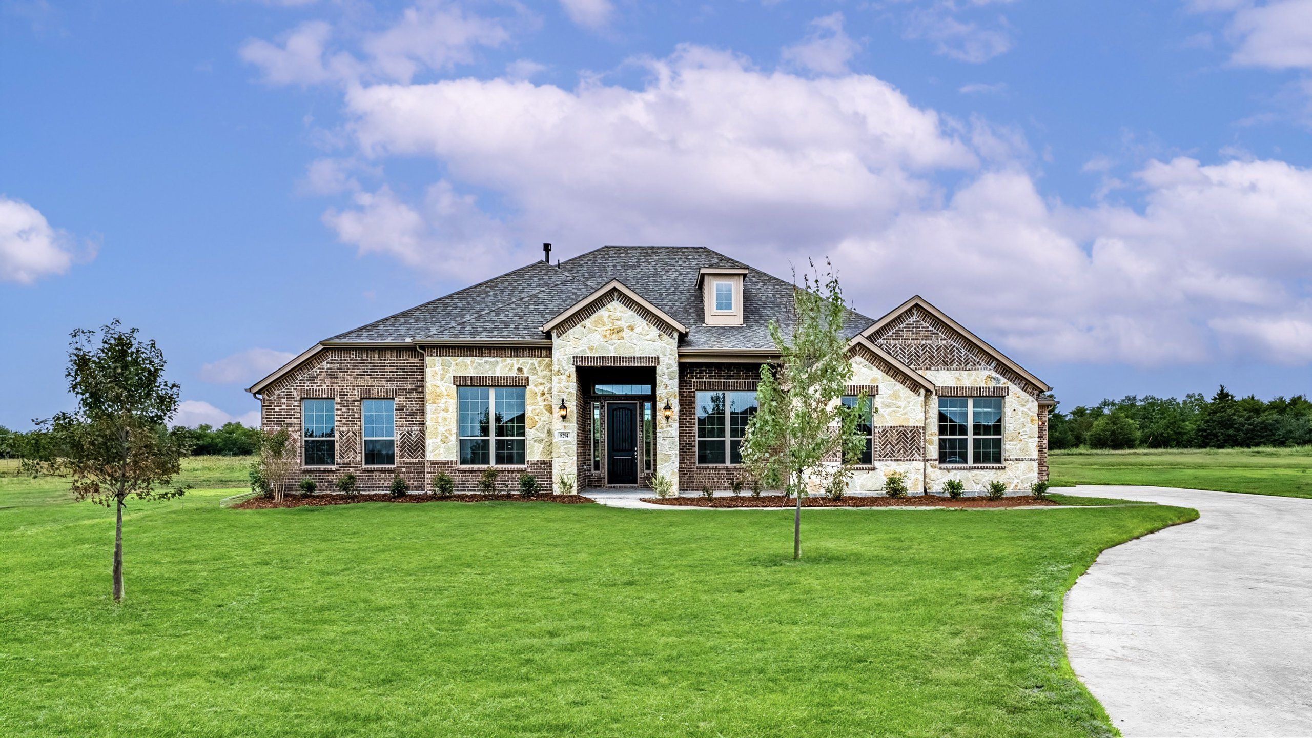 Front exterior of a new home in Creekview Farms, Greenville, TX, highlighting curb appeal (Image 1). Front exterior of a new home in Creekview Farms, Greenville, TX, highlighting curb appeal (Image 1).