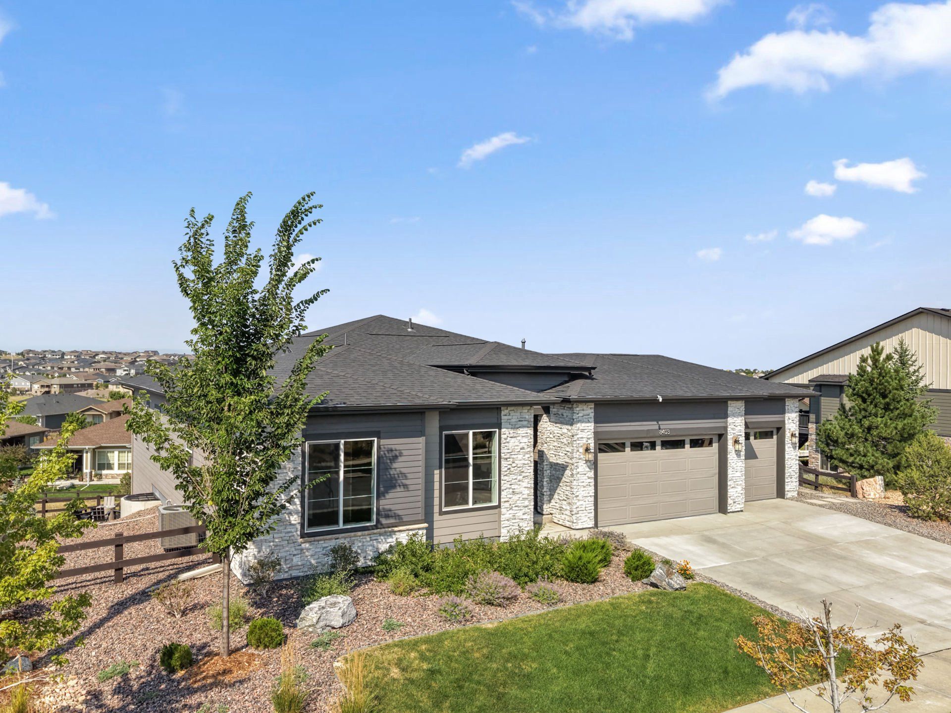 Front exterior of a new home in Hilltop at Inspiration, Aurora, CO, highlighting curb appeal (Image 1). Front exterior of a new home in Hilltop at Inspiration, Aurora, CO, highlighting curb appeal (Image 1).