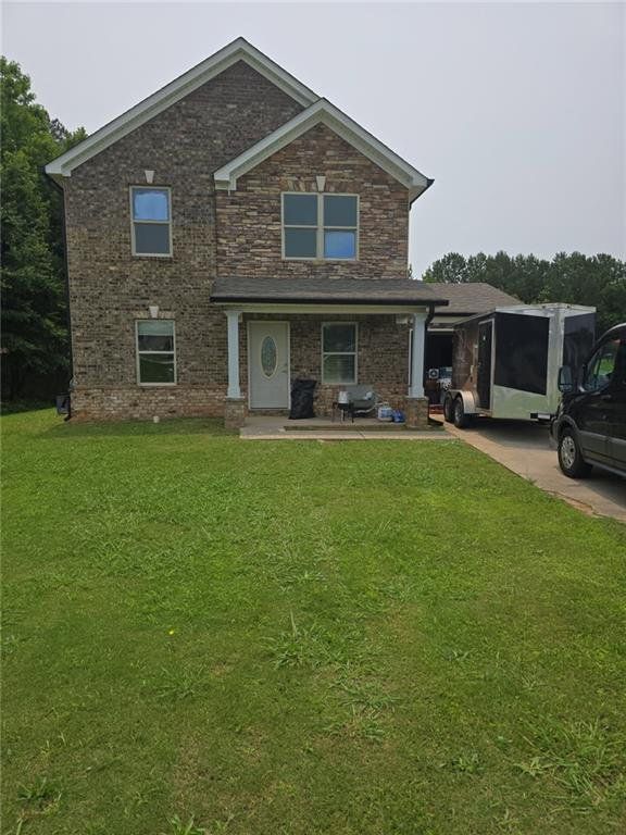 Front exterior of a new home in , Jonesboro, GA, highlighting curb appeal (Image 1).