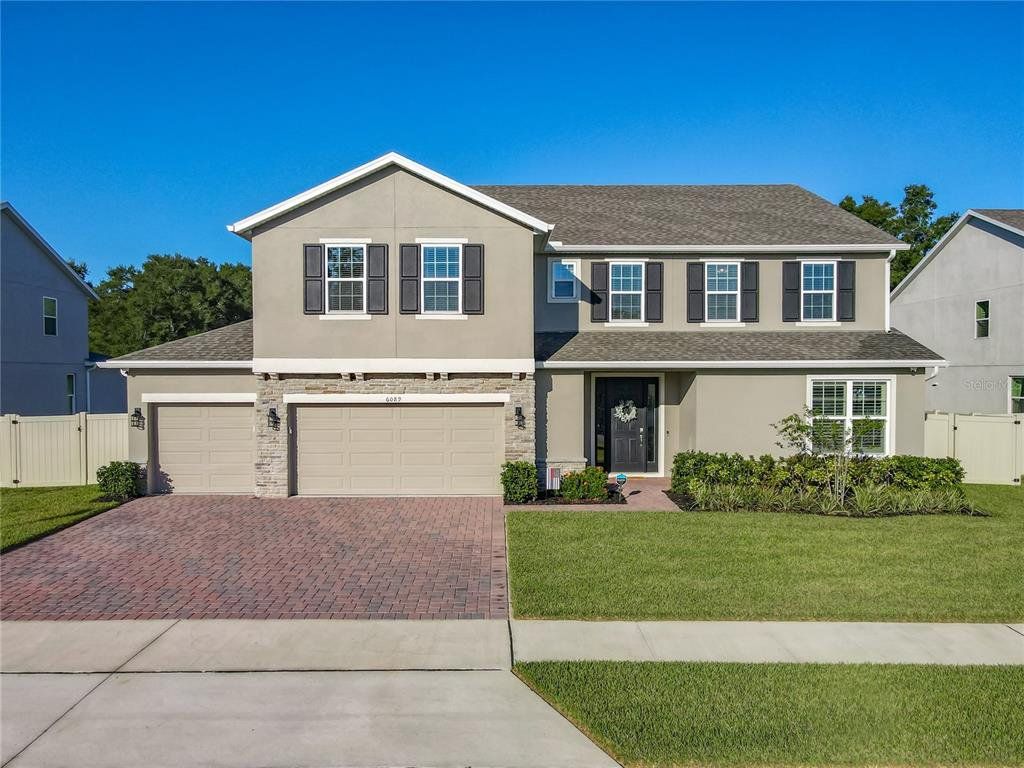 Front exterior of a new home in , Mount Dora, FL, highlighting curb appeal (Image 1). Front exterior of a new home in , Mount Dora, FL, highlighting curb appeal (Image 1).