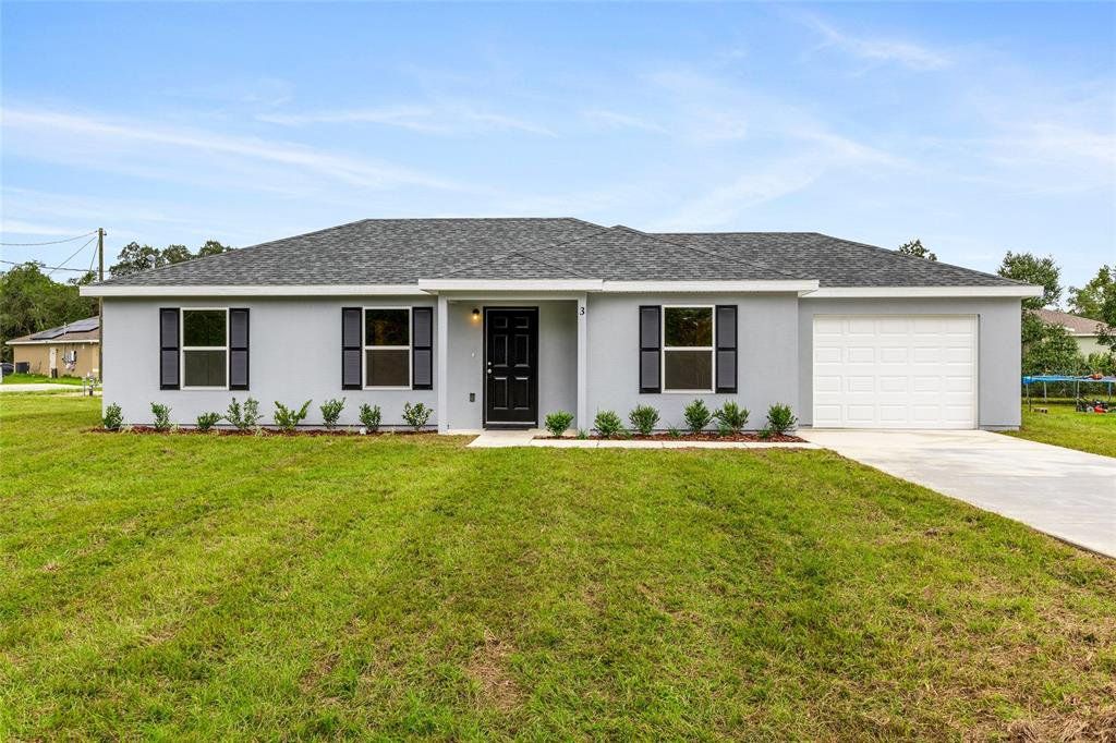 Front exterior of a new home in , Ocala, FL, highlighting curb appeal (Image 1). Front exterior of a new home in , Ocala, FL, highlighting curb appeal (Image 1).