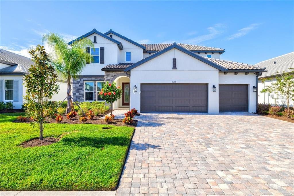 Front exterior of a new home in , Bradenton, FL, highlighting curb appeal (Image 1). Front exterior of a new home in , Bradenton, FL, highlighting curb appeal (Image 1).