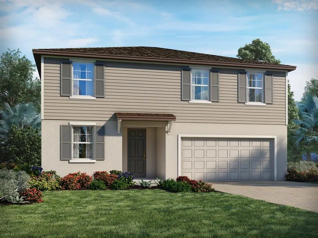 Front exterior of a new home in Deer Run at Crosswinds, Davenport, FL, highlighting curb appeal (Image 1).
