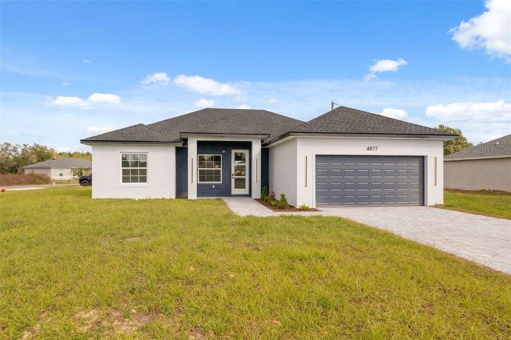 Front exterior of a new home in , Ocala, FL, highlighting curb appeal (Image 1). Front exterior of a new home in , Ocala, FL, highlighting curb appeal (Image 1).