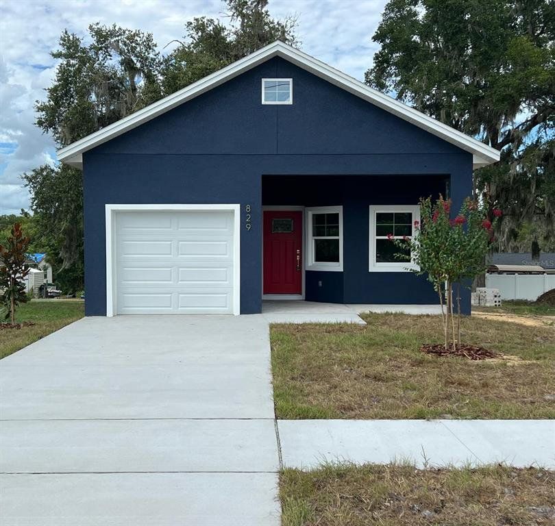Front exterior of a new home in , Eustis, FL, highlighting curb appeal (Image 1). Front exterior of a new home in , Eustis, FL, highlighting curb appeal (Image 1).