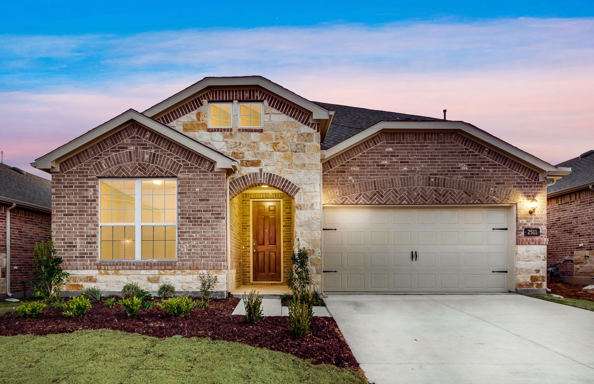Front exterior of a new home in Pecan Square, Northlake, TX, highlighting curb appeal (Image 1). Front exterior of a new home in Pecan Square, Northlake, TX, highlighting curb appeal (Image 1).