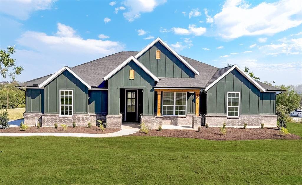 Front exterior of a new home in Rocky Top Ranch, Reno, TX, highlighting curb appeal (Image 1).