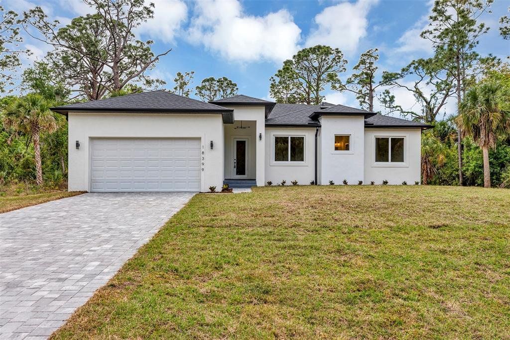 Front exterior of a new home in , Port Charlotte, FL, highlighting curb appeal (Image 1). Front exterior of a new home in , Port Charlotte, FL, highlighting curb appeal (Image 1).