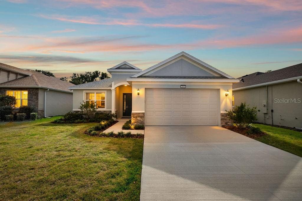 Front exterior of a new home in , Mount Dora, FL, highlighting curb appeal (Image 1). Front exterior of a new home in , Mount Dora, FL, highlighting curb appeal (Image 1).