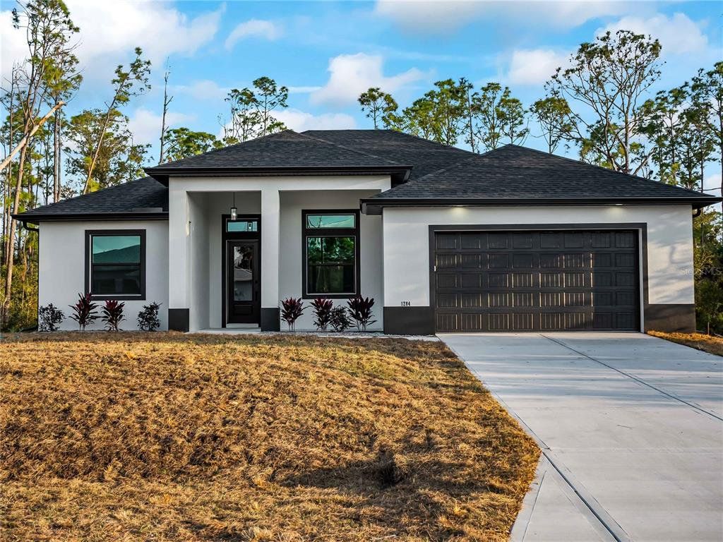 Front exterior of a new home in , Port Charlotte, FL, highlighting curb appeal (Image 1). Front exterior of a new home in , Port Charlotte, FL, highlighting curb appeal (Image 1).