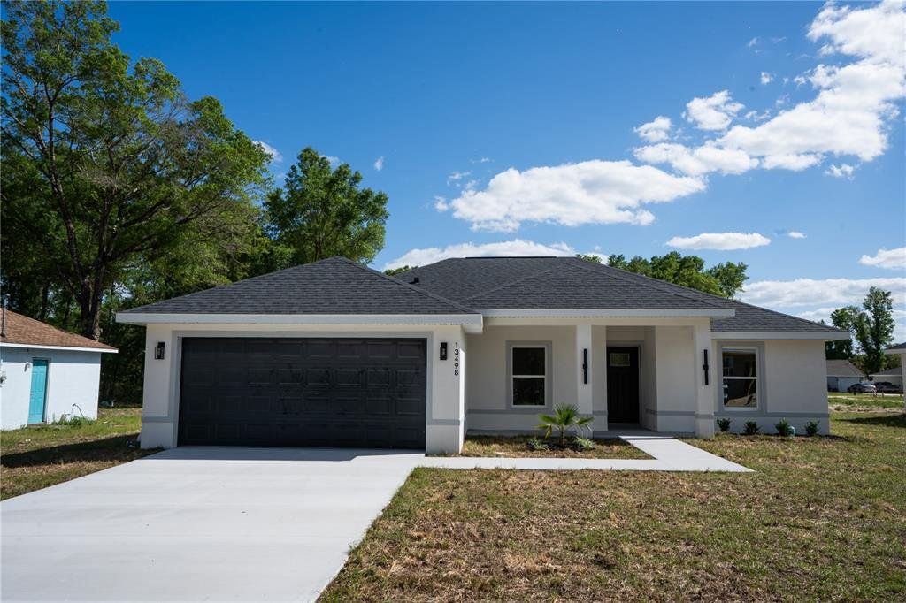 Front exterior of a new home in , Dunnellon, FL, highlighting curb appeal (Image 1). Front exterior of a new home in , Dunnellon, FL, highlighting curb appeal (Image 1).