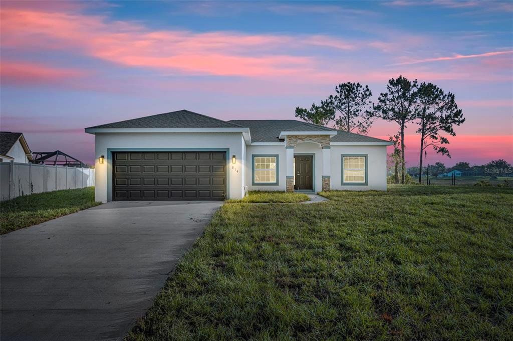Front exterior of a new home in , Deltona, FL, highlighting curb appeal (Image 1). Front exterior of a new home in , Deltona, FL, highlighting curb appeal (Image 1).
