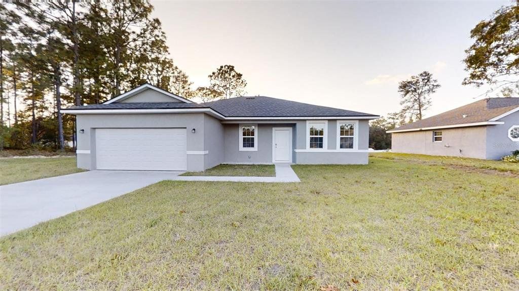 Front exterior of a new home in , Dunnellon, FL, highlighting curb appeal (Image 1). Front exterior of a new home in , Dunnellon, FL, highlighting curb appeal (Image 1).