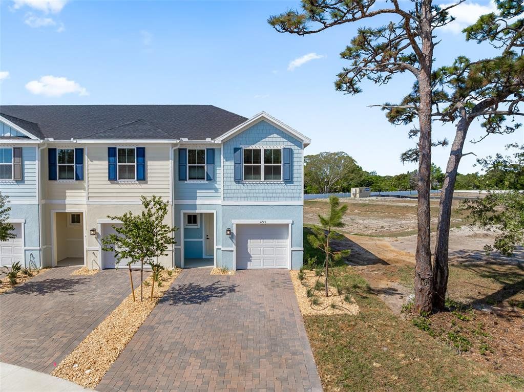 Front exterior of a new home in Kendall Pointe, Melbourne, FL, highlighting curb appeal (Image 1). Front exterior of a new home in Kendall Pointe, Melbourne, FL, highlighting curb appeal (Image 1).
