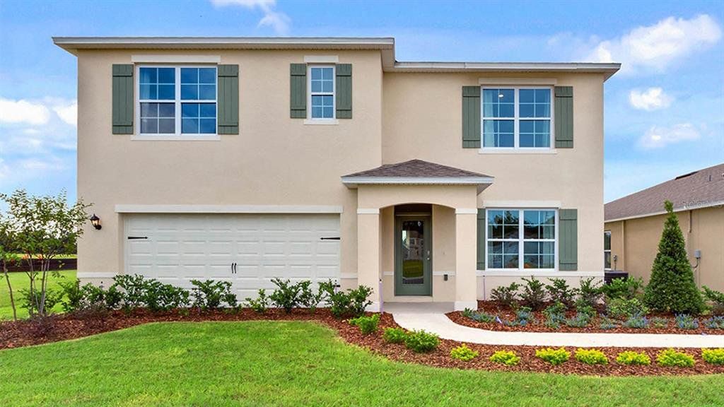 Front exterior of a new home in Harmony West, St. Cloud, FL, highlighting curb appeal (Image 1). Front exterior of a new home in Harmony West, St. Cloud, FL, highlighting curb appeal (Image 1).