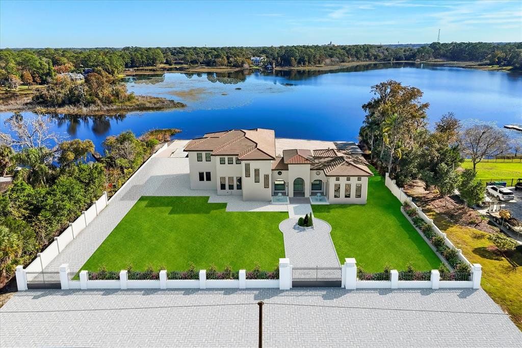 Front exterior of a new home in , Lake Mary, FL, highlighting curb appeal (Image 1). Front exterior of a new home in , Lake Mary, FL, highlighting curb appeal (Image 1).