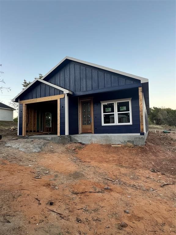 View of front of property featuring board and batten siding and a porch