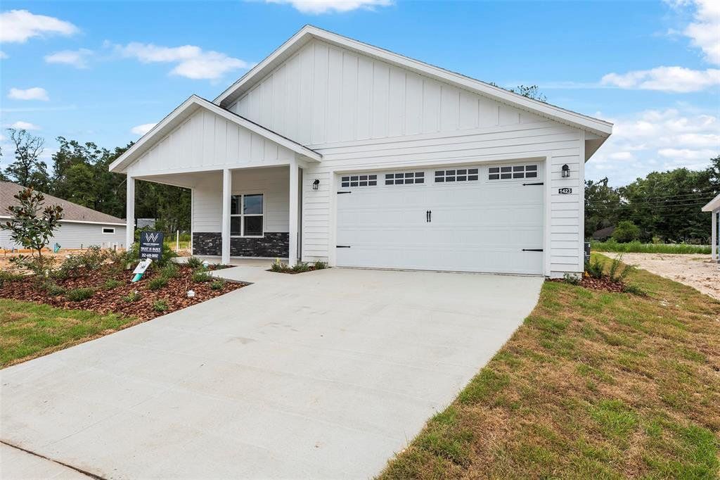 Front exterior of a new home in Grand Oaks, Gainesville, FL, highlighting curb appeal (Image 1). Front exterior of a new home in Grand Oaks, Gainesville, FL, highlighting curb appeal (Image 1).