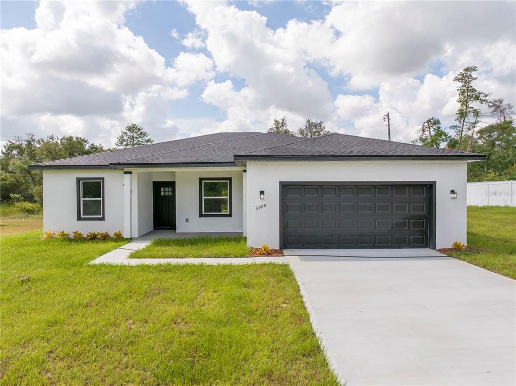 Front exterior of a new home in , Ocala, FL, highlighting curb appeal (Image 1). Front exterior of a new home in , Ocala, FL, highlighting curb appeal (Image 1).