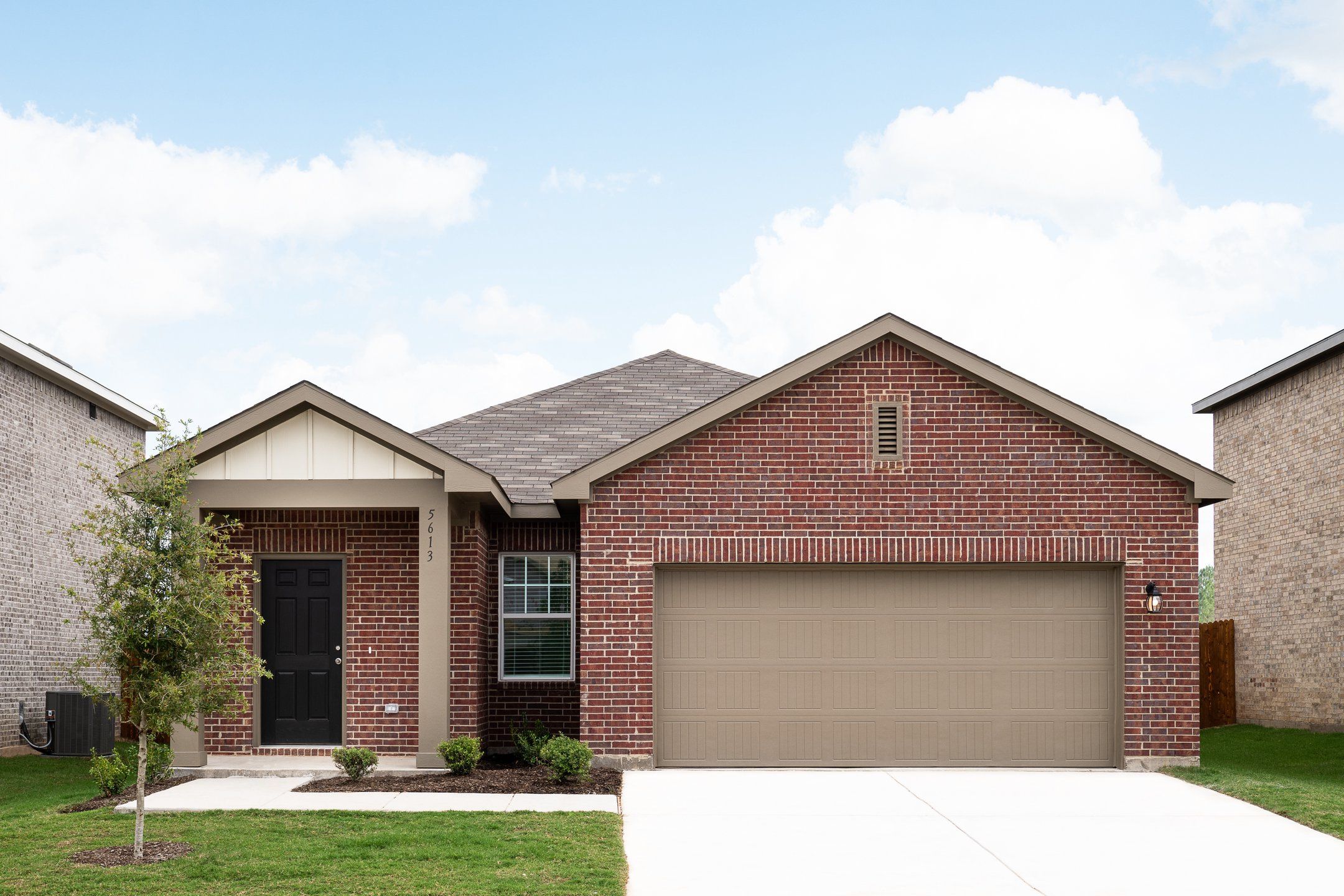 Front exterior of a new home in Trails at Culebra, San Antonio, TX, highlighting curb appeal (Image 1).