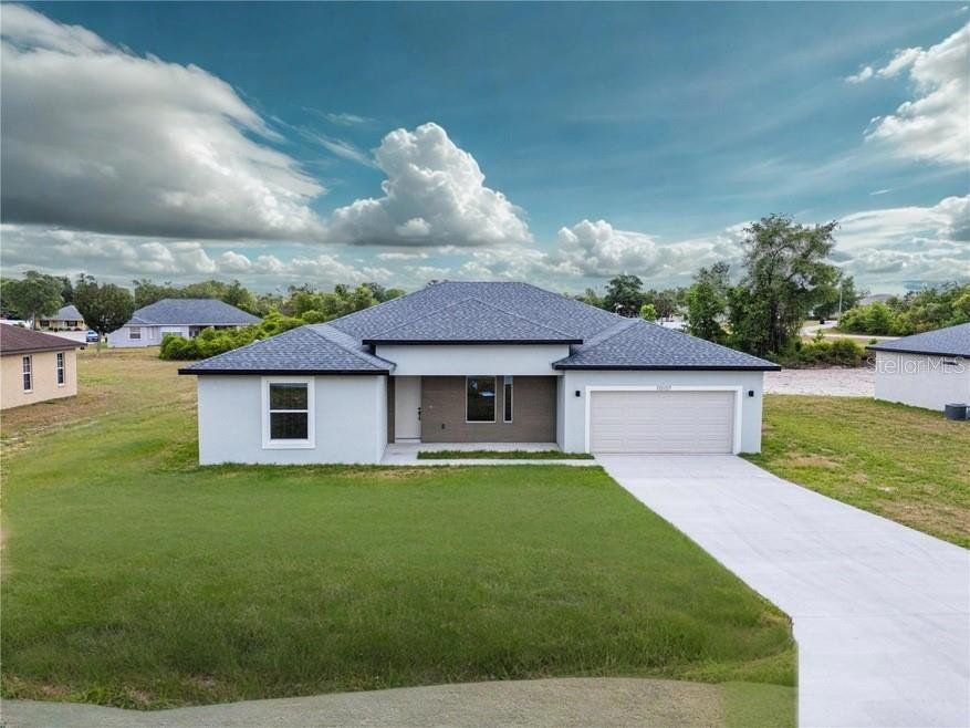 Front exterior of a new home in , Ocala, FL, highlighting curb appeal (Image 1). Front exterior of a new home in , Ocala, FL, highlighting curb appeal (Image 1).